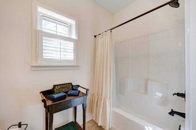 bathroom featuring shower / bathtub combination with curtain