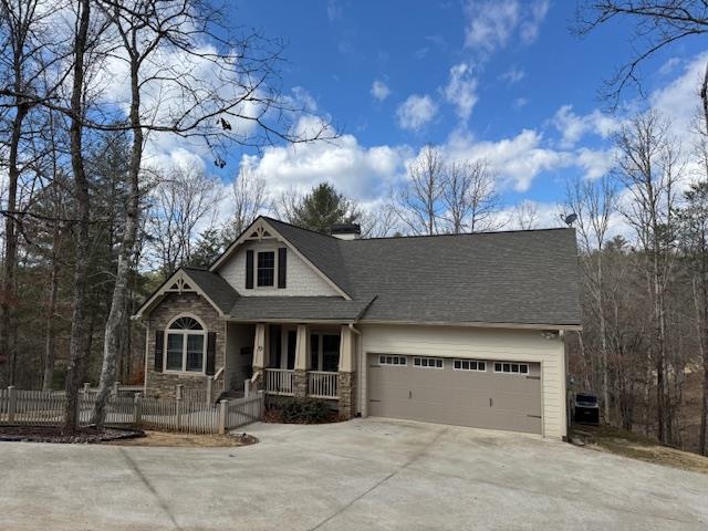 view of front of home featuring a garage and covered porch