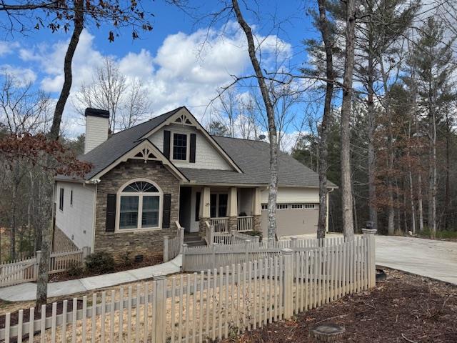 craftsman-style home with a garage and a porch