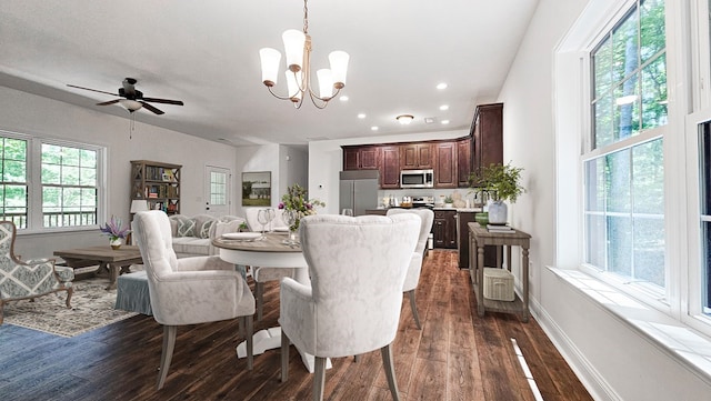 dining room with dark wood finished floors, recessed lighting, baseboards, and ceiling fan with notable chandelier