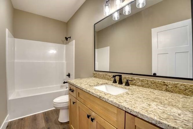 full bathroom featuring shower / bathing tub combination, vanity, wood-type flooring, and toilet