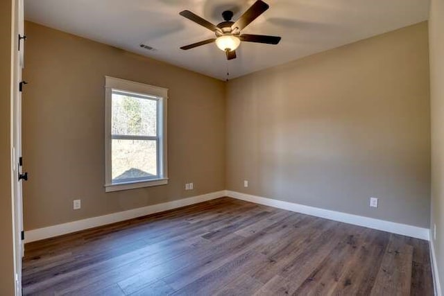 unfurnished room with hardwood / wood-style flooring and ceiling fan