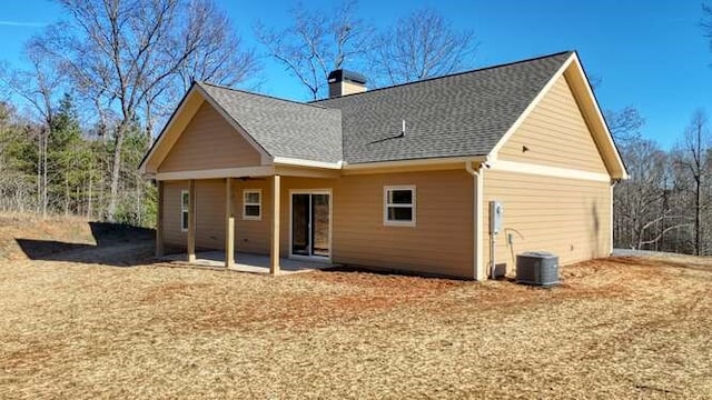 back of property featuring central AC and a patio area