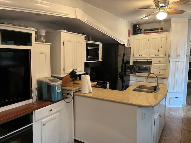 142 Gander Gap Rd, Hiawassee, GA 30546 - kitchen with built in microwave, white cabinetry, a ceiling fan, and a sink