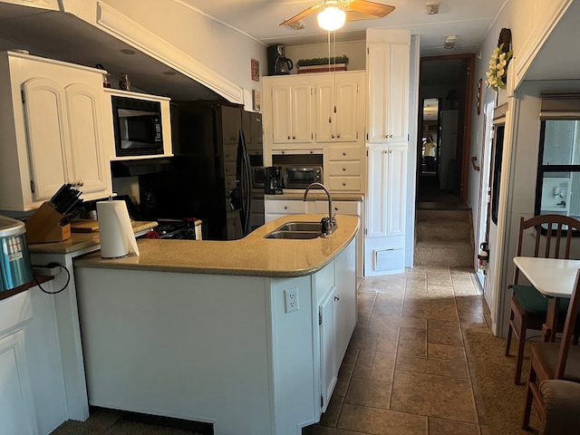 142 Gander Gap Rd, Hiawassee, GA 30546 - kitchen with a peninsula, built in microwave, ceiling fan, a sink, and white cabinets