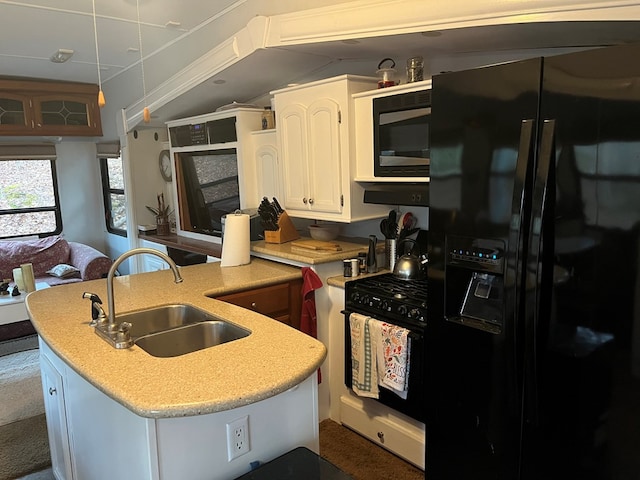142 Gander Gap Rd, Hiawassee, GA 30546 - kitchen featuring white cabinets, a peninsula, black appliances, and a sink
