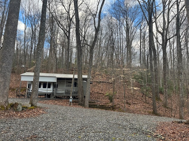 142 Gander Gap Rd, Hiawassee, GA 30546 - view of front of property featuring a carport, covered porch, and metal roof