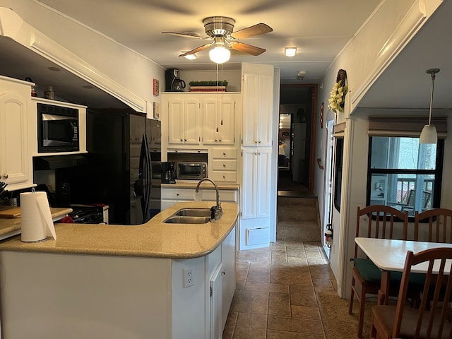 142 Gander Gap Rd, Hiawassee, GA 30546 - kitchen with white cabinetry, ceiling fan, built in microwave, and a sink