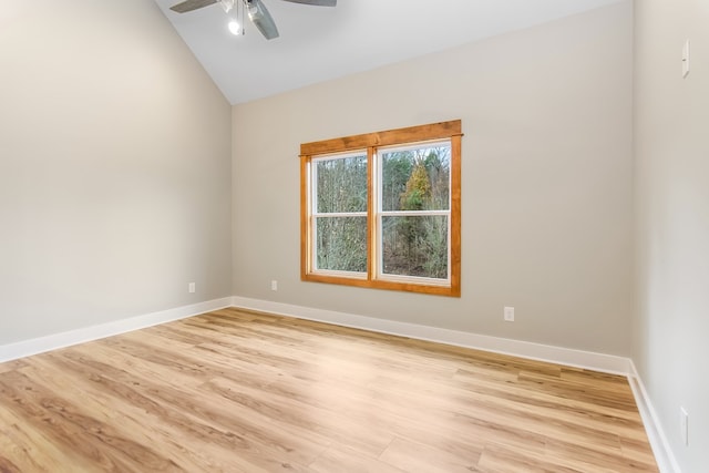 unfurnished room with ceiling fan, light hardwood / wood-style floors, and lofted ceiling