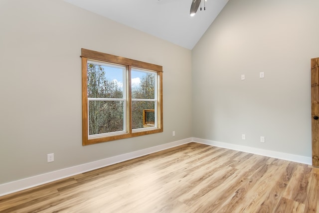 unfurnished room with ceiling fan, lofted ceiling, and light hardwood / wood-style flooring