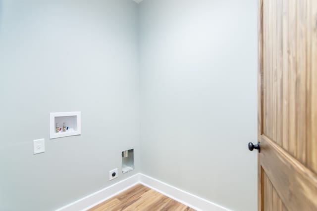 laundry area with hookup for an electric dryer, wood-type flooring, and hookup for a washing machine