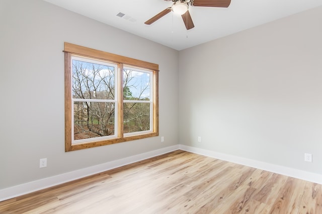 unfurnished room featuring ceiling fan and light hardwood / wood-style floors