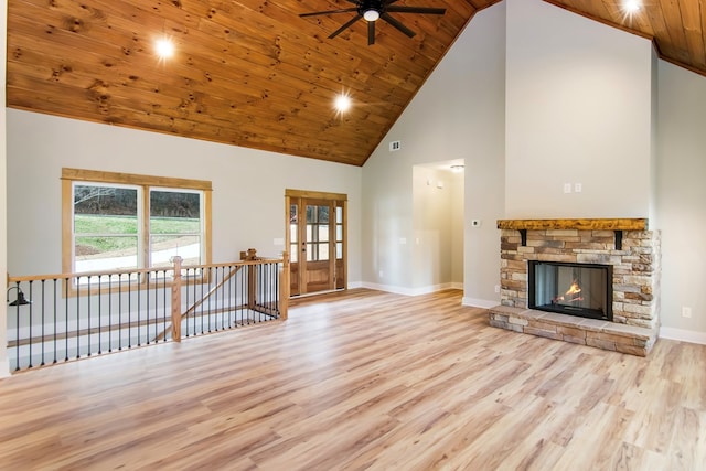 unfurnished living room featuring wooden ceiling, a fireplace, high vaulted ceiling, and light hardwood / wood-style flooring