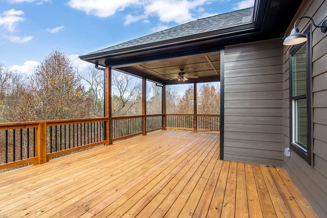 wooden deck featuring ceiling fan