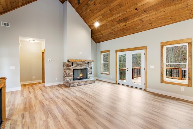 unfurnished living room with french doors, high vaulted ceiling, wood ceiling, and light wood-type flooring