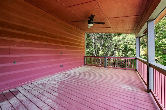 wooden deck featuring ceiling fan