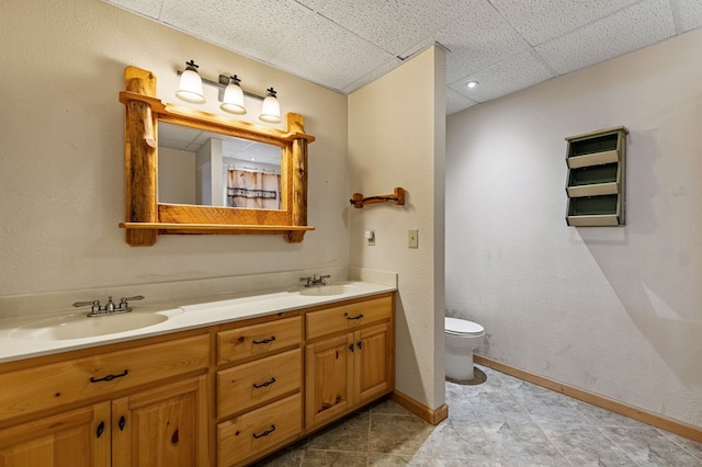 bathroom featuring toilet and vanity