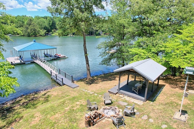 view of dock featuring a water view and a fire pit