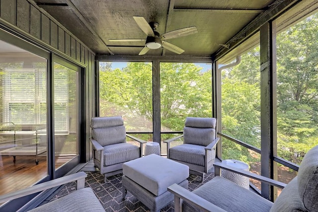sunroom featuring ceiling fan