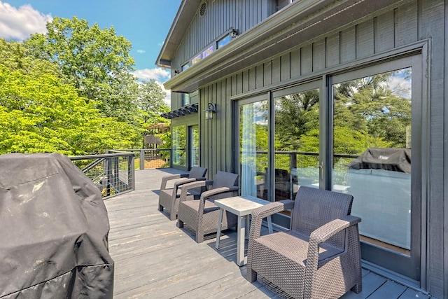 wooden deck with grilling area