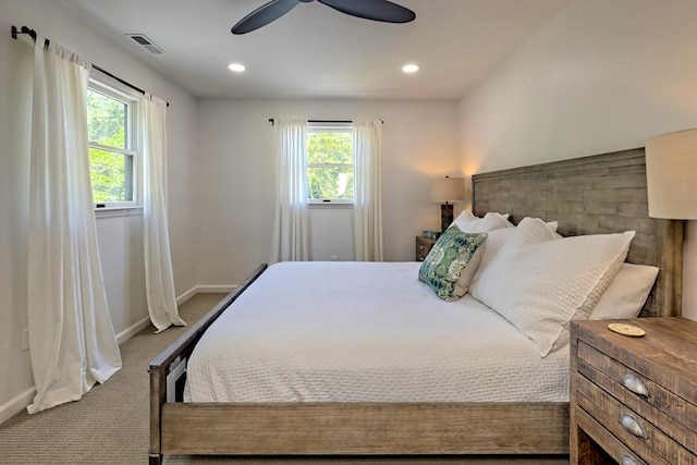 carpeted bedroom featuring baseboards, recessed lighting, ceiling fan, and visible vents