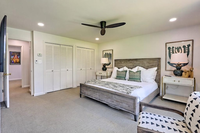 bedroom featuring multiple closets, baseboards, recessed lighting, a ceiling fan, and carpet