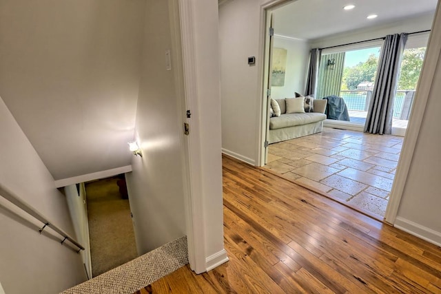 hall with baseboards, recessed lighting, and hardwood / wood-style flooring