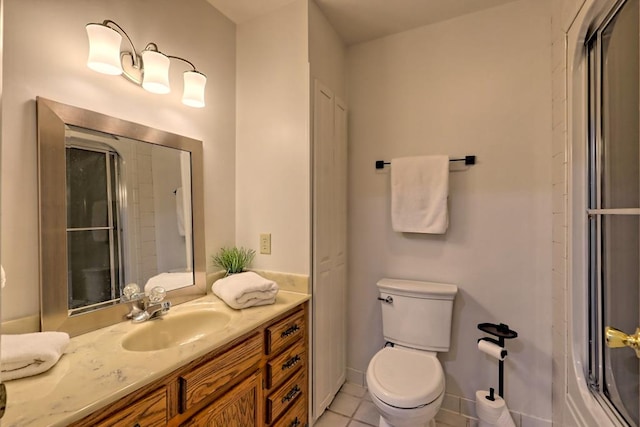bathroom featuring an enclosed shower, tile patterned floors, vanity, and toilet