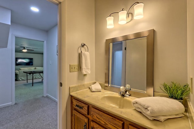bathroom with vanity and baseboards