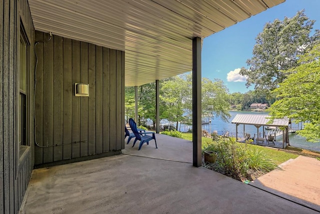 view of patio / terrace with a water view and a gazebo