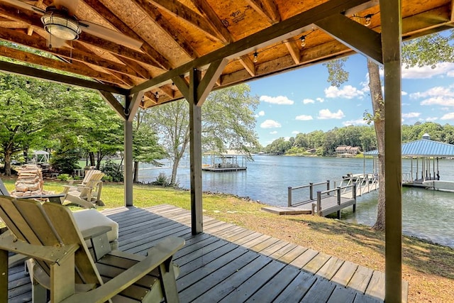 dock area featuring a yard and a water view