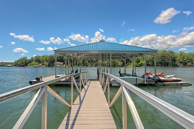 view of dock featuring boat lift and a water view