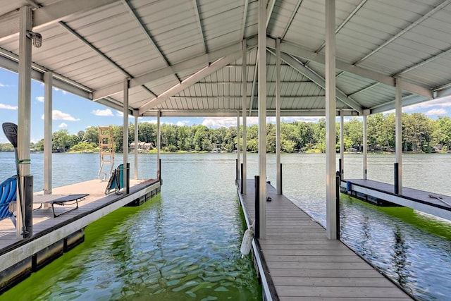view of dock featuring a water view and boat lift