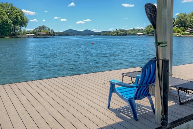dock area featuring a water and mountain view