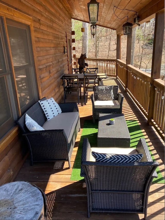 wooden deck with an outdoor hangout area