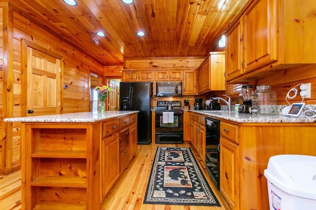 kitchen featuring black appliances, light wood-type flooring, sink, a kitchen island, and wood ceiling