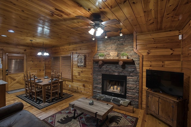 living room with wood ceiling, a fireplace, ceiling fan, and hardwood / wood-style floors