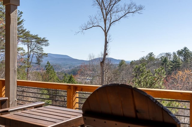 wooden deck featuring a mountain view