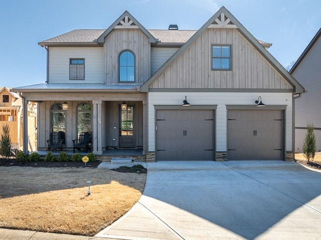 modern farmhouse style home with board and batten siding, covered porch, driveway, and a shingled roof