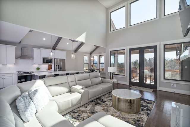 living room featuring high vaulted ceiling, dark hardwood / wood-style floors, beamed ceiling, and french doors