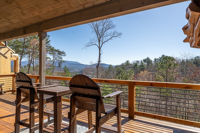 wooden deck featuring a mountain view