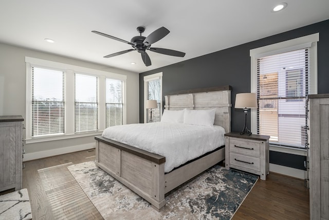 bedroom with ceiling fan and hardwood / wood-style floors