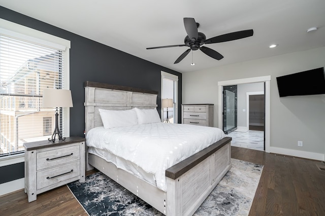 bedroom with ceiling fan, hardwood / wood-style flooring, and connected bathroom