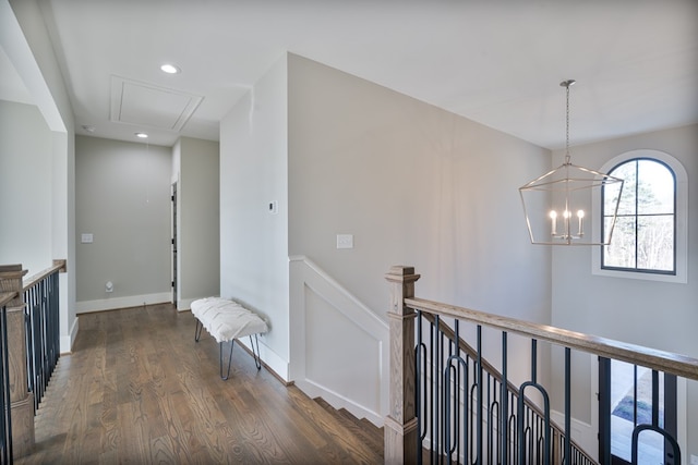 hall featuring dark wood-type flooring, baseboards, attic access, an upstairs landing, and recessed lighting