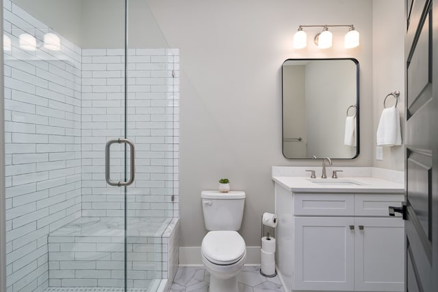 bathroom featuring baseboards, toilet, a stall shower, marble finish floor, and vanity