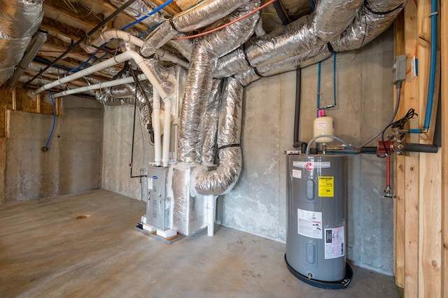 utility room featuring water heater