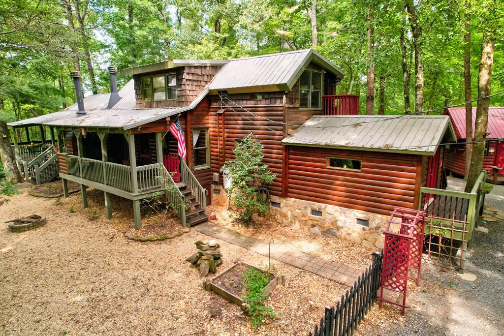 25 Briar Creek Dr, Ellijay, GA 30540 - back of property featuring stairs, metal roof, crawl space, and a wooden deck