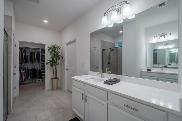 bathroom featuring vanity and walk in shower