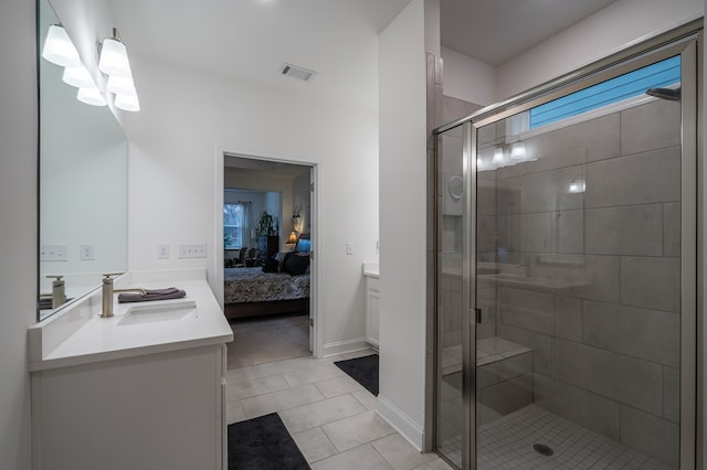 bathroom with tile patterned flooring, vanity, and an enclosed shower