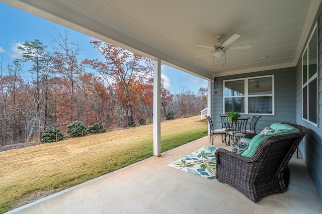 view of patio featuring ceiling fan